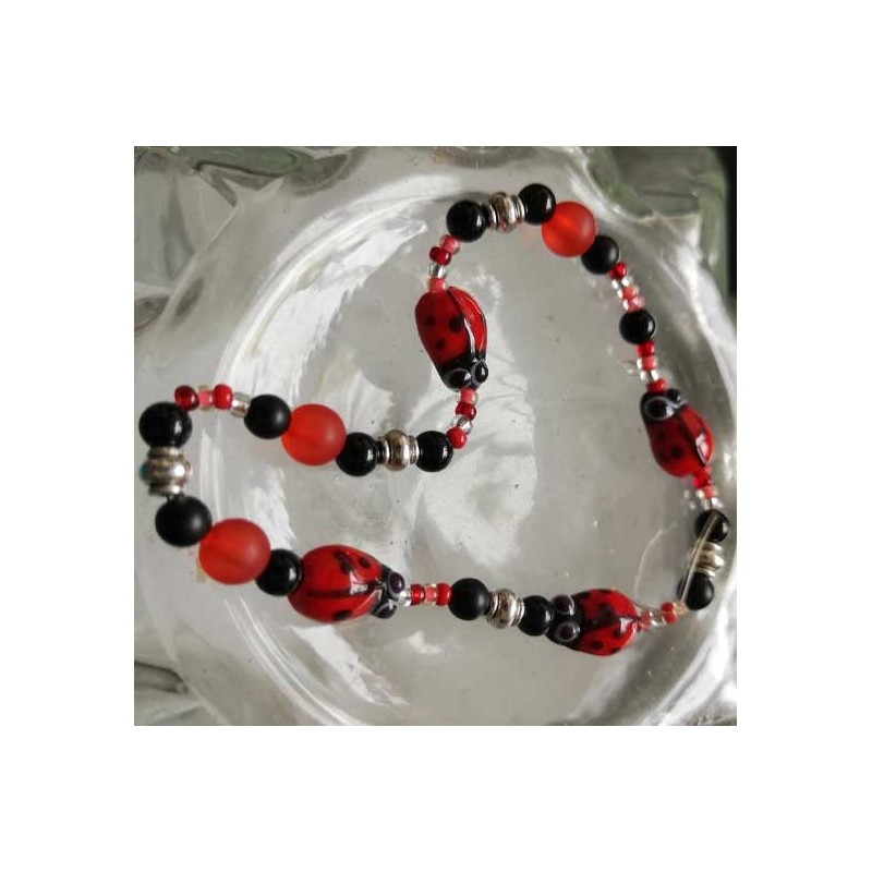 Toute petite coccinelle rouge en verre  X 2