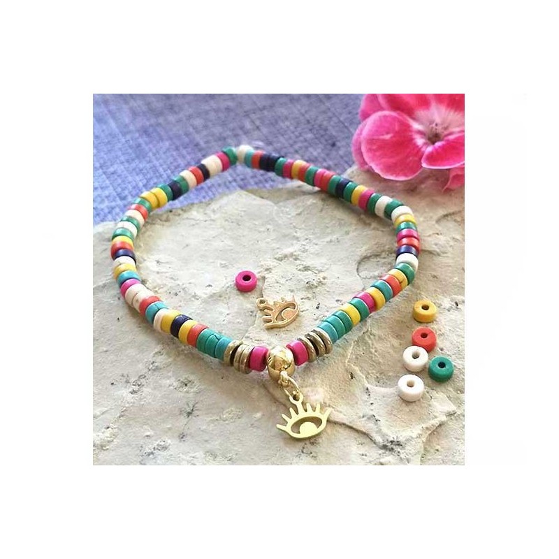 Breloque oeil porte bonheur 9x8mm acier inox doré x1